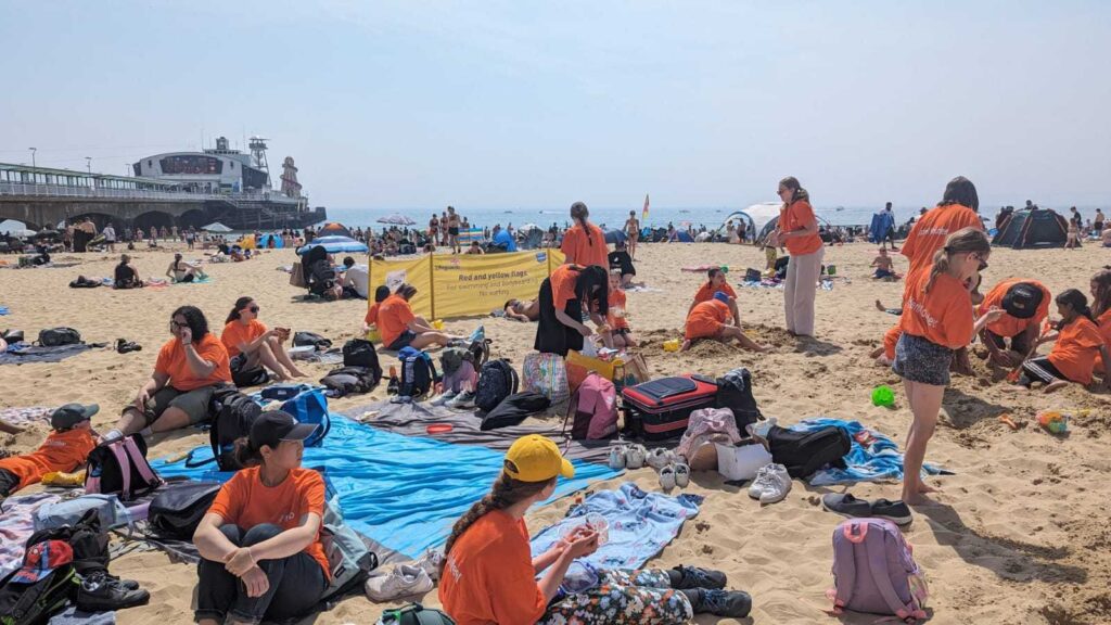 ID: Branch Up young people and volunteers enjoy a day at the beach