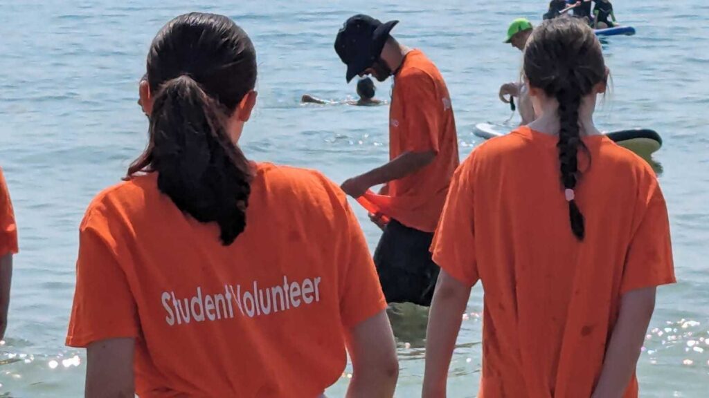 ID: a student volunteer looks out to sea on a Branch Up day